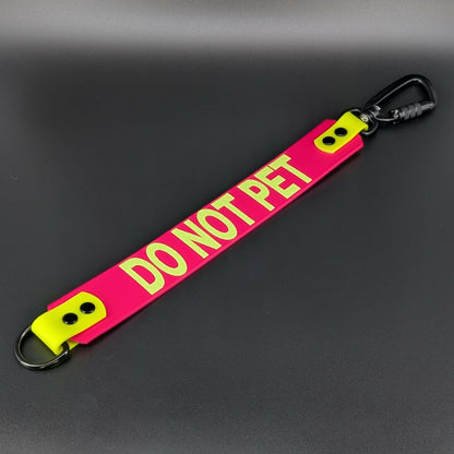 pink and yellow do not pet leash warning