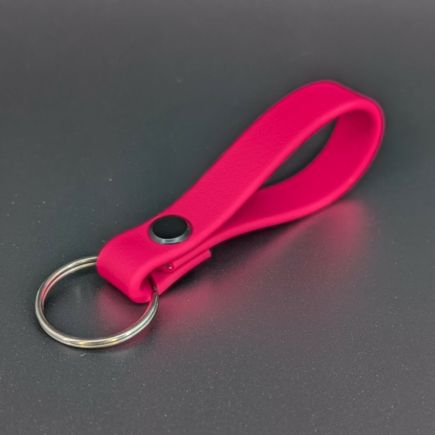 pink biothane key ring with black hardware
