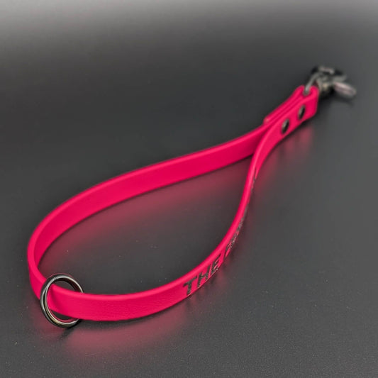 pink biothane traffic handle with floating o ring and black hardware