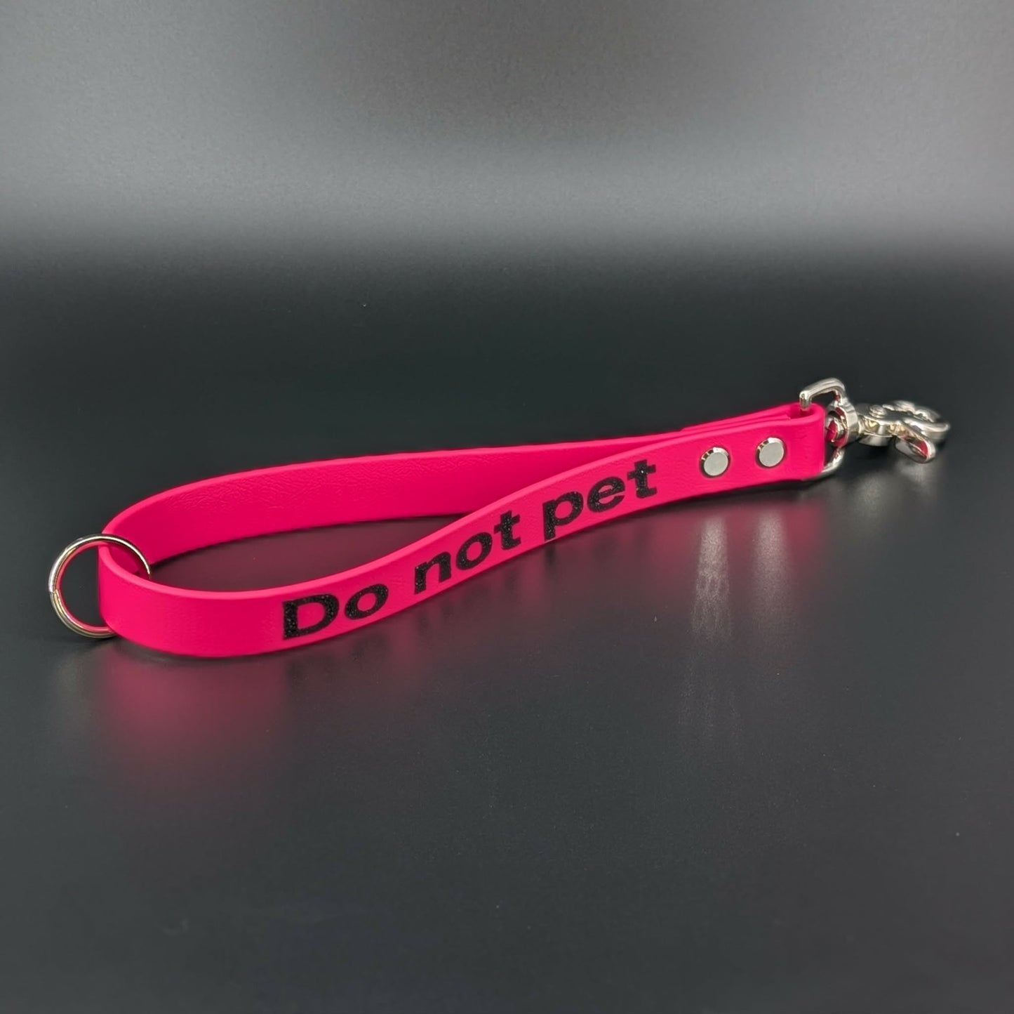 pink biothane traffic handle with glitter do not pet text