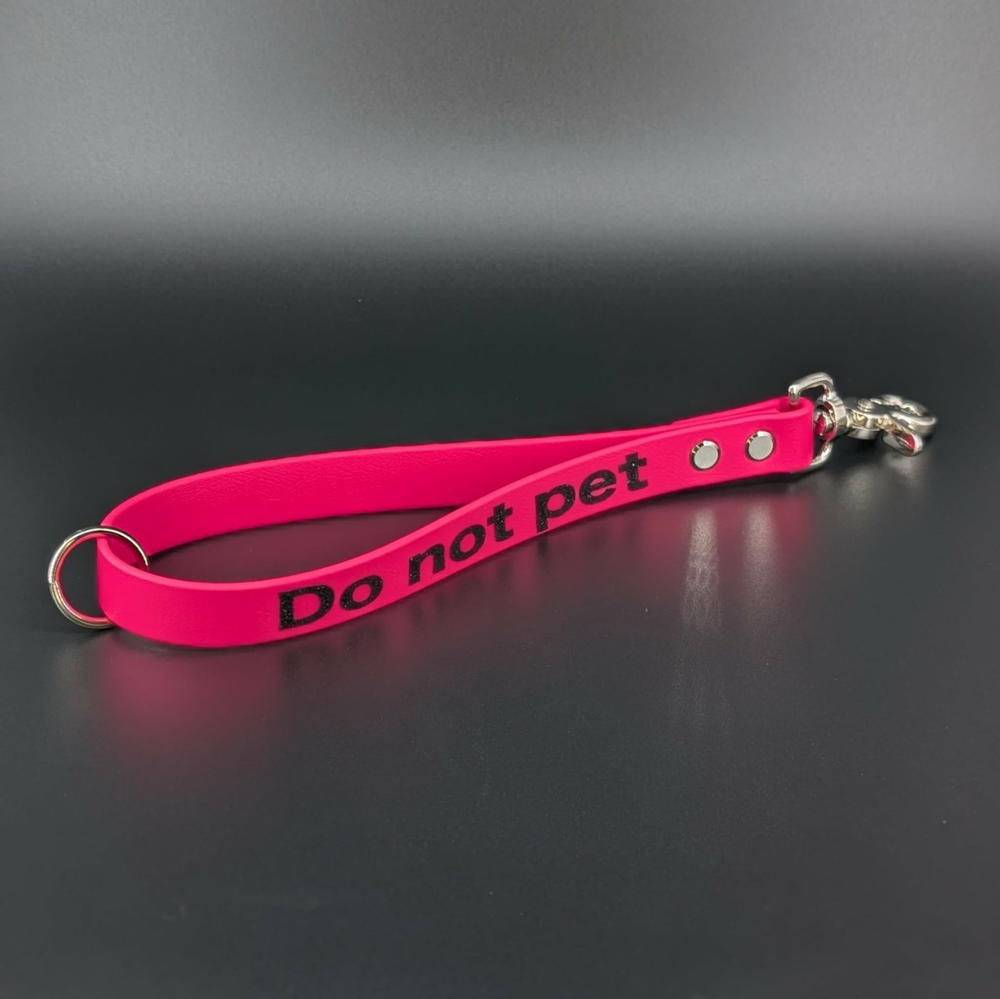 pink biothane traffic handle with glitter do not pet text