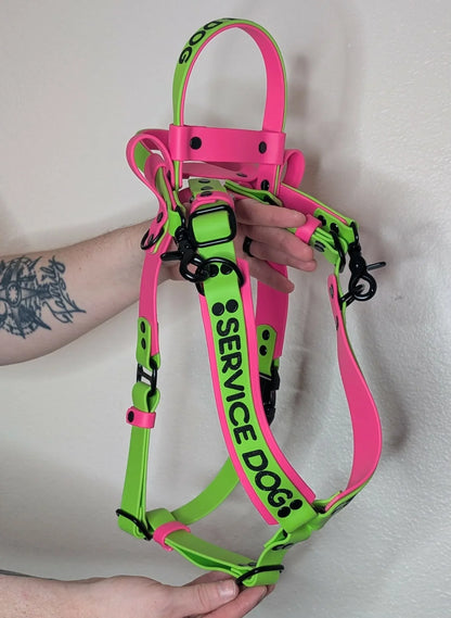 green and pink biothane mobility service dog harness with pull strap and counterbalance handle