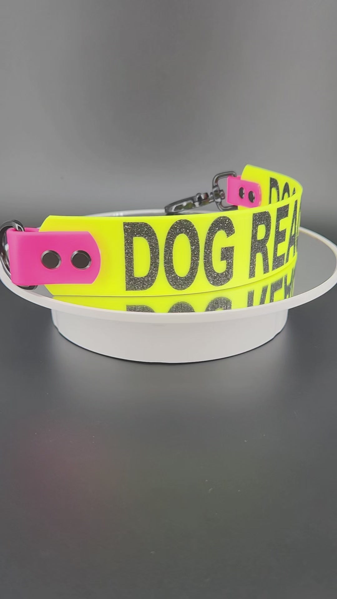 1.5 inch wide yellow and pink biothane leash wrap alternative leash extender warning reading DOG REACTIVE in big bold black glitter text