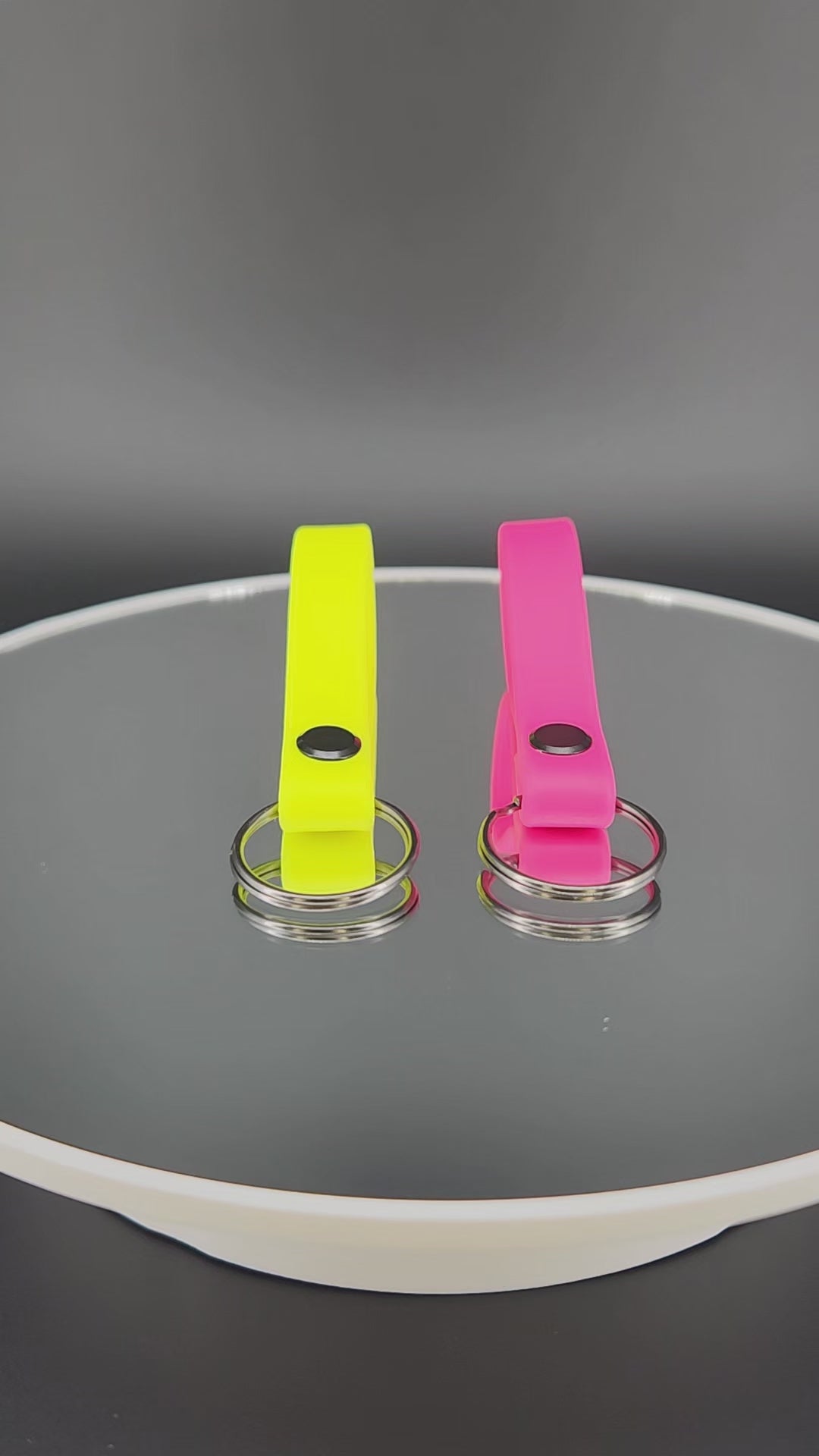 pink and yellow biothane key ring tabs
