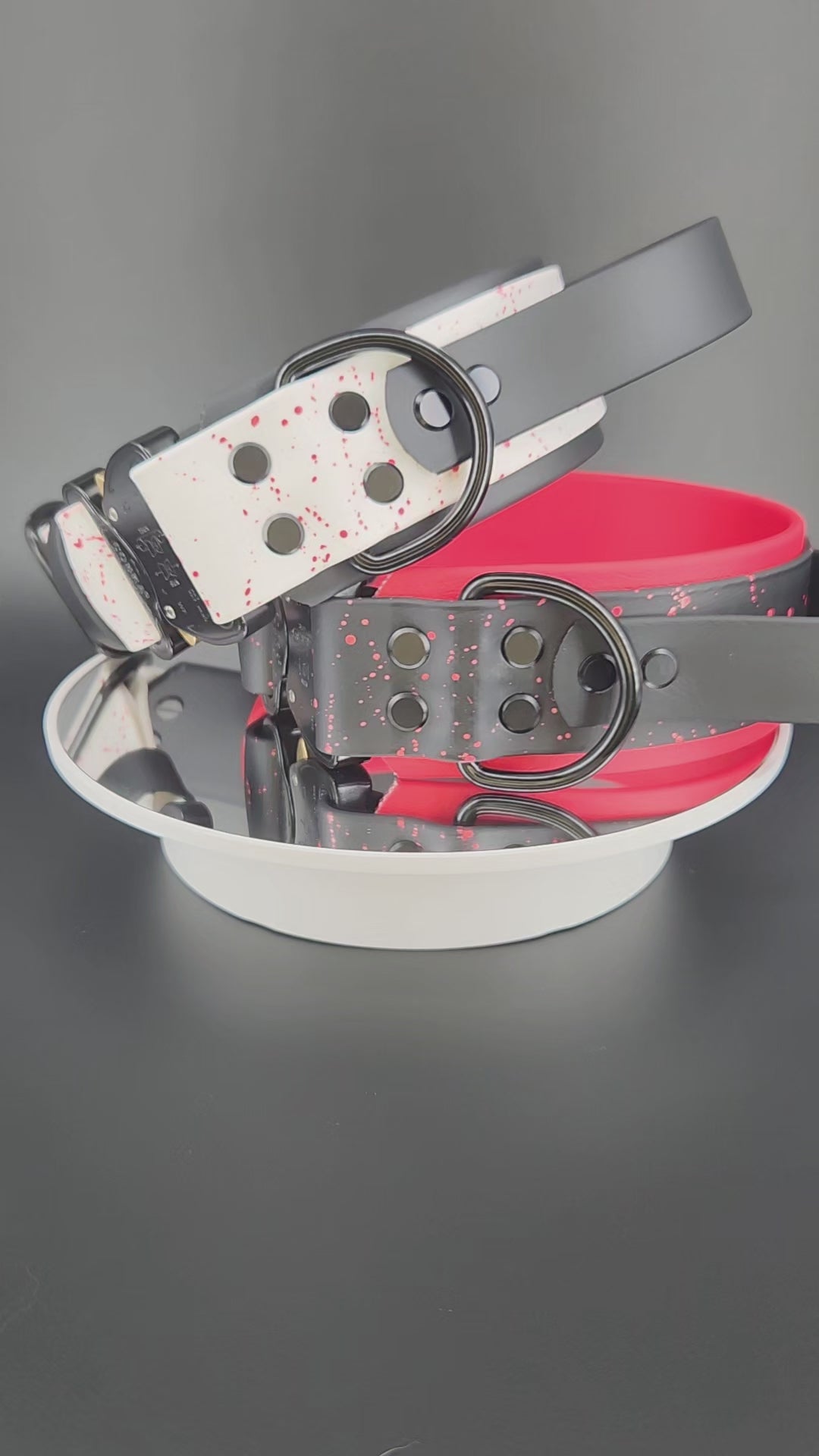 2 inch wide layered biothane dog collars, each with a tactical handle, splatter paint, custom glitter text, and quick release cobra buckle