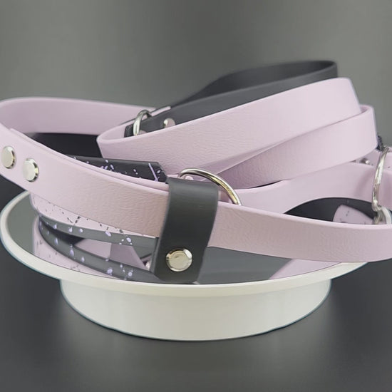 lavender and black layered biothane French martingale with splatter paint and custom text reading : Unvested Service Dog