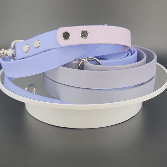 periwinkle blue, gray, and lavender biothane over the shoulder hands free dog leash with adjustable waist attachment point and built in traffic handle