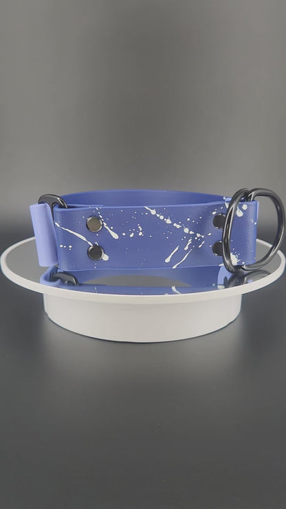 1.5 inch wide navy blue and periwinkle blue biothane limited slip dog collar with splatter paint and glitter feral af text