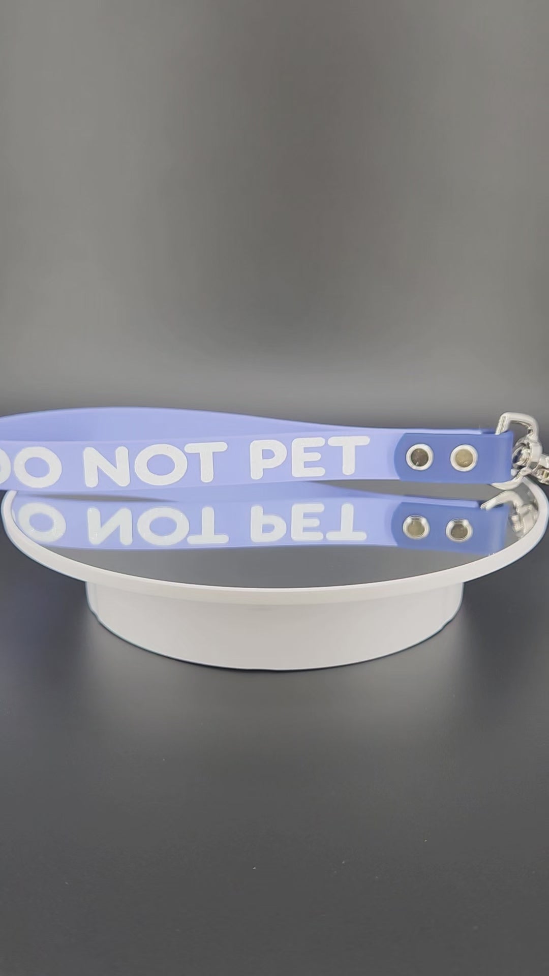 periwinkle and navy blue biothane traffic handle with silver floating o ring and trigger snap with white glitter DO NOT PET text