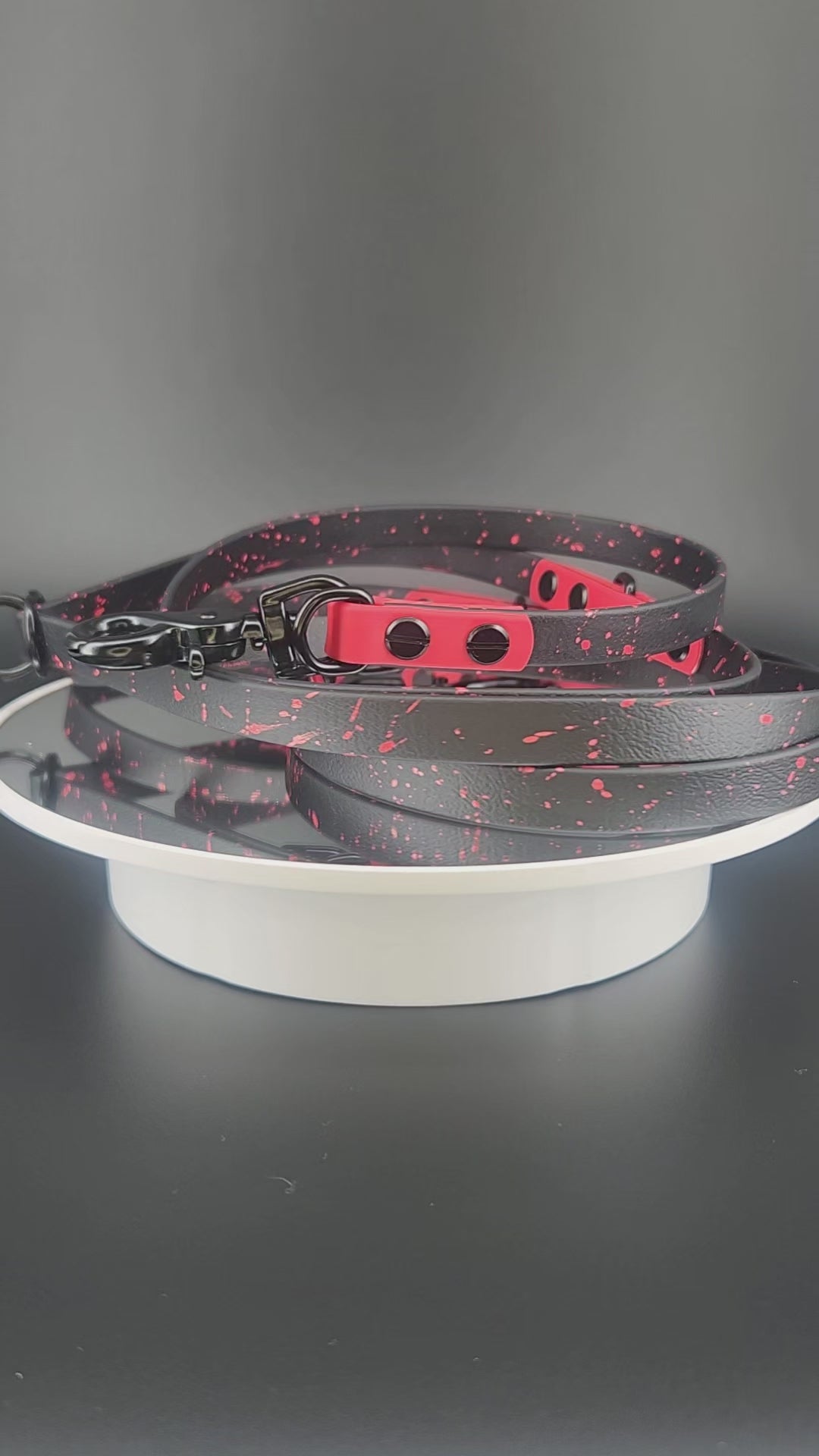 black and red biothane hands free dog leash with black hardware and red splatter paint