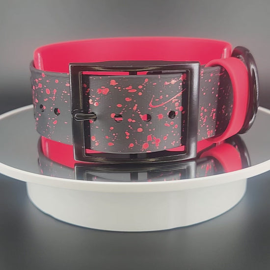 2 inch wide red and black layered biothane dog collar with custom glitter text and splatter paint