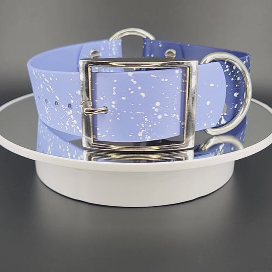 navy and periwinkle blue biothane collar with tag ring and white splatter paint that looks like stars or a galaxy celestial theme collar