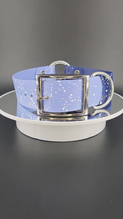 navy and periwinkle blue biothane collar with tag ring and white splatter paint that looks like stars or a galaxy celestial theme collar