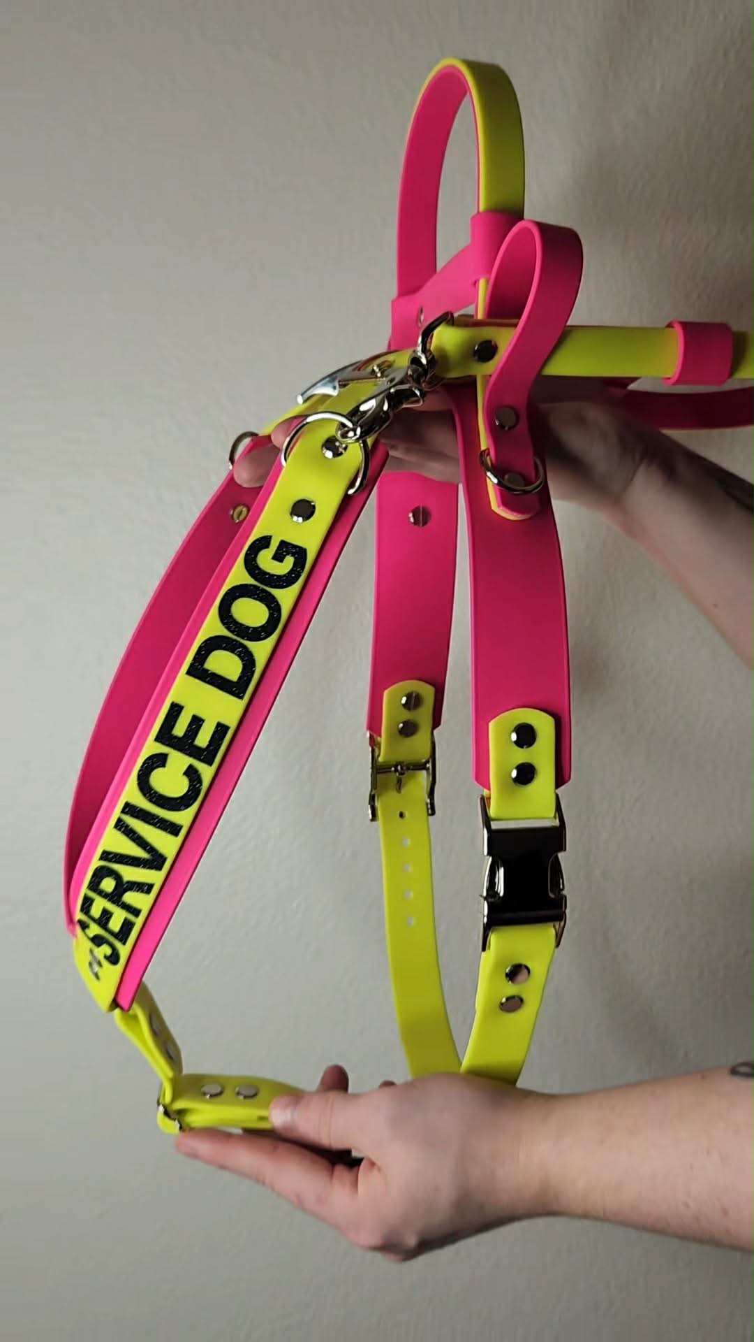 pink and yellow biothane y front service dog harness with built-in counterbalance handle and detachable pull strap