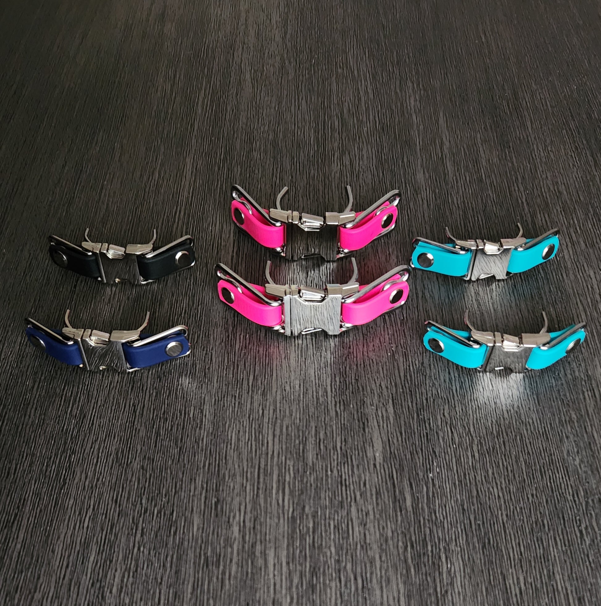 6 quick release prong collar buckle attachments with black, dark blue, light blue, and pink biothane