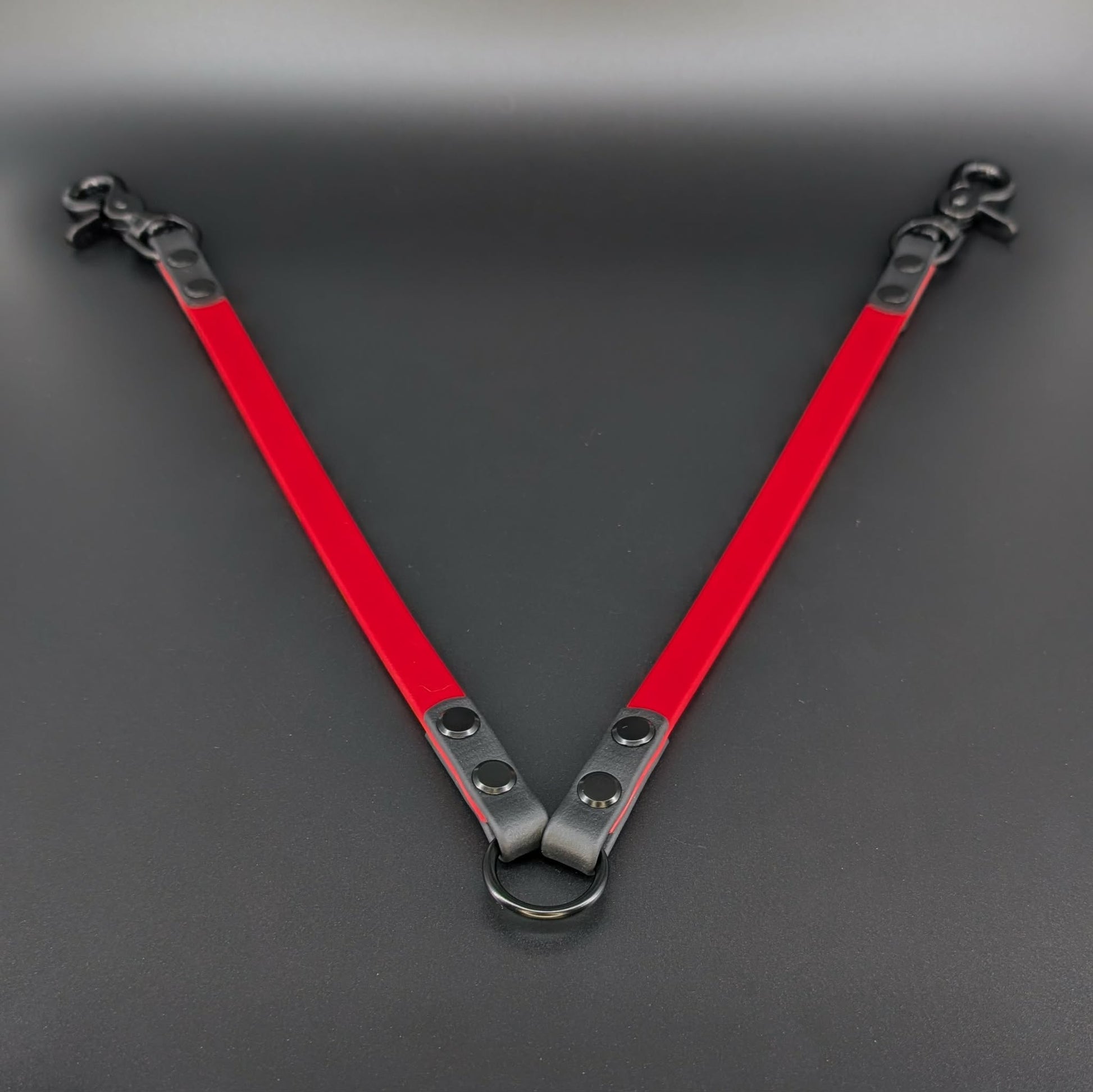 red and black biothane leash coupler for walking two dogs
