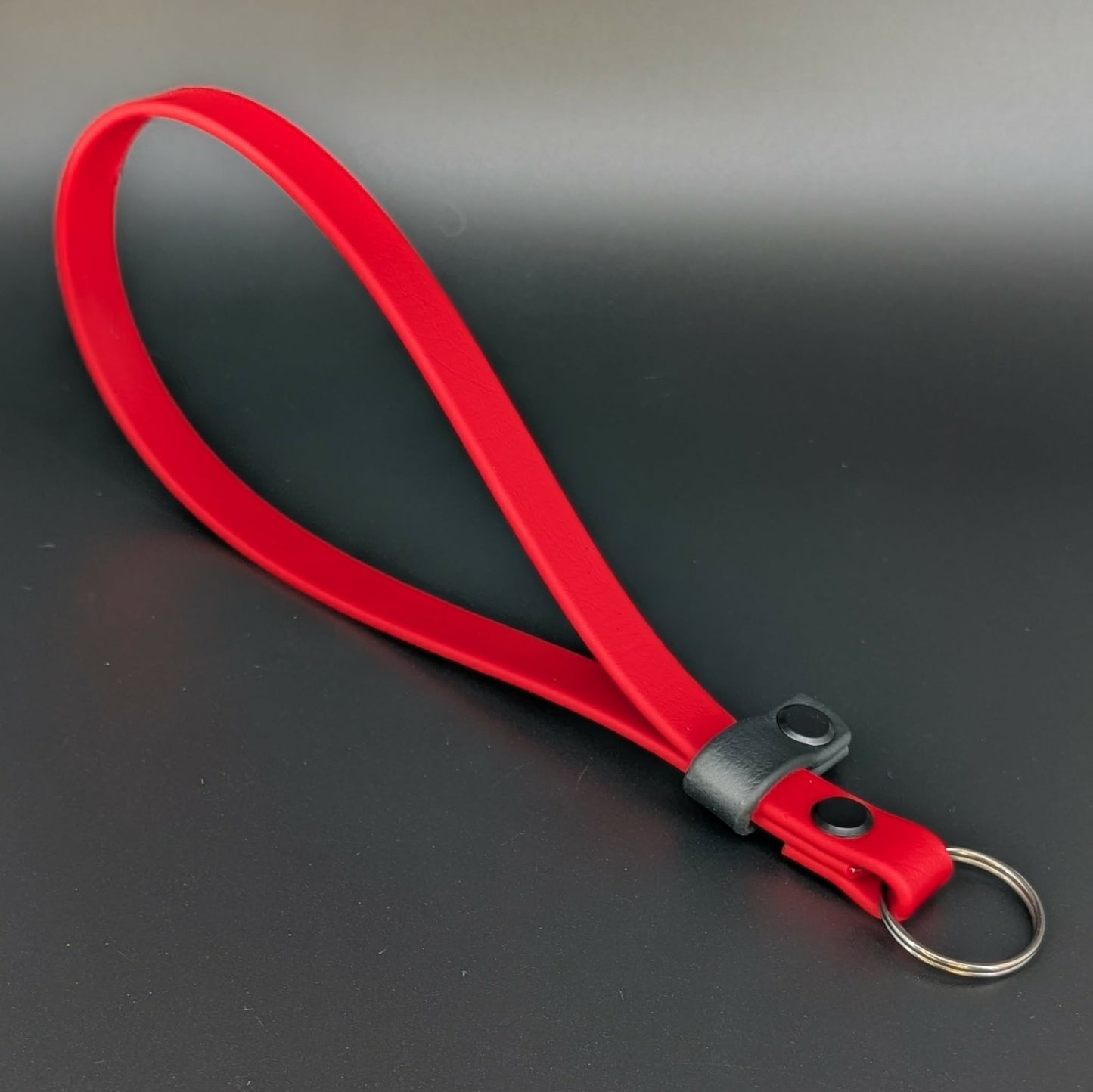 red and black biothane wrist strap for e-collar remote