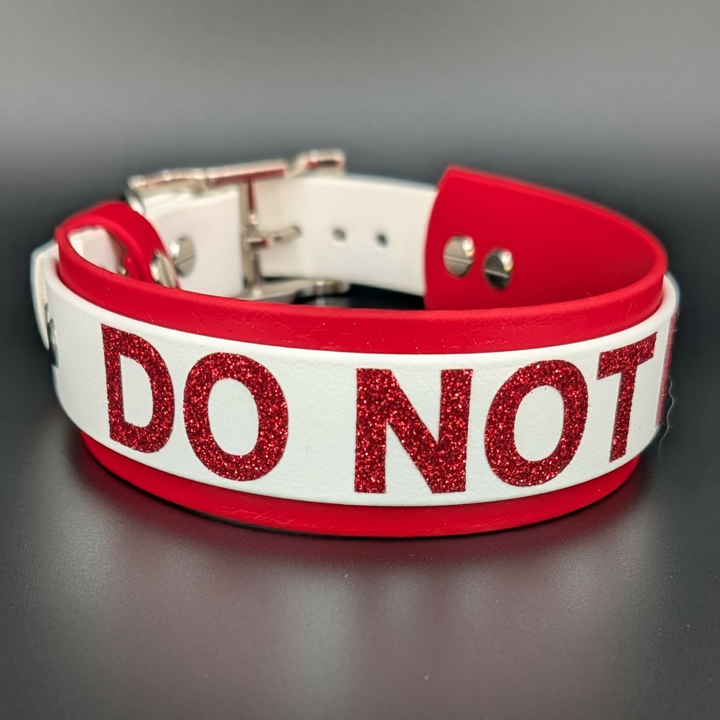 Red and white layered biothane dog collar with 'DO NOT PET' text