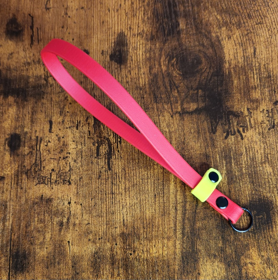 red and yellow biothane e-collar remote wrist strap
