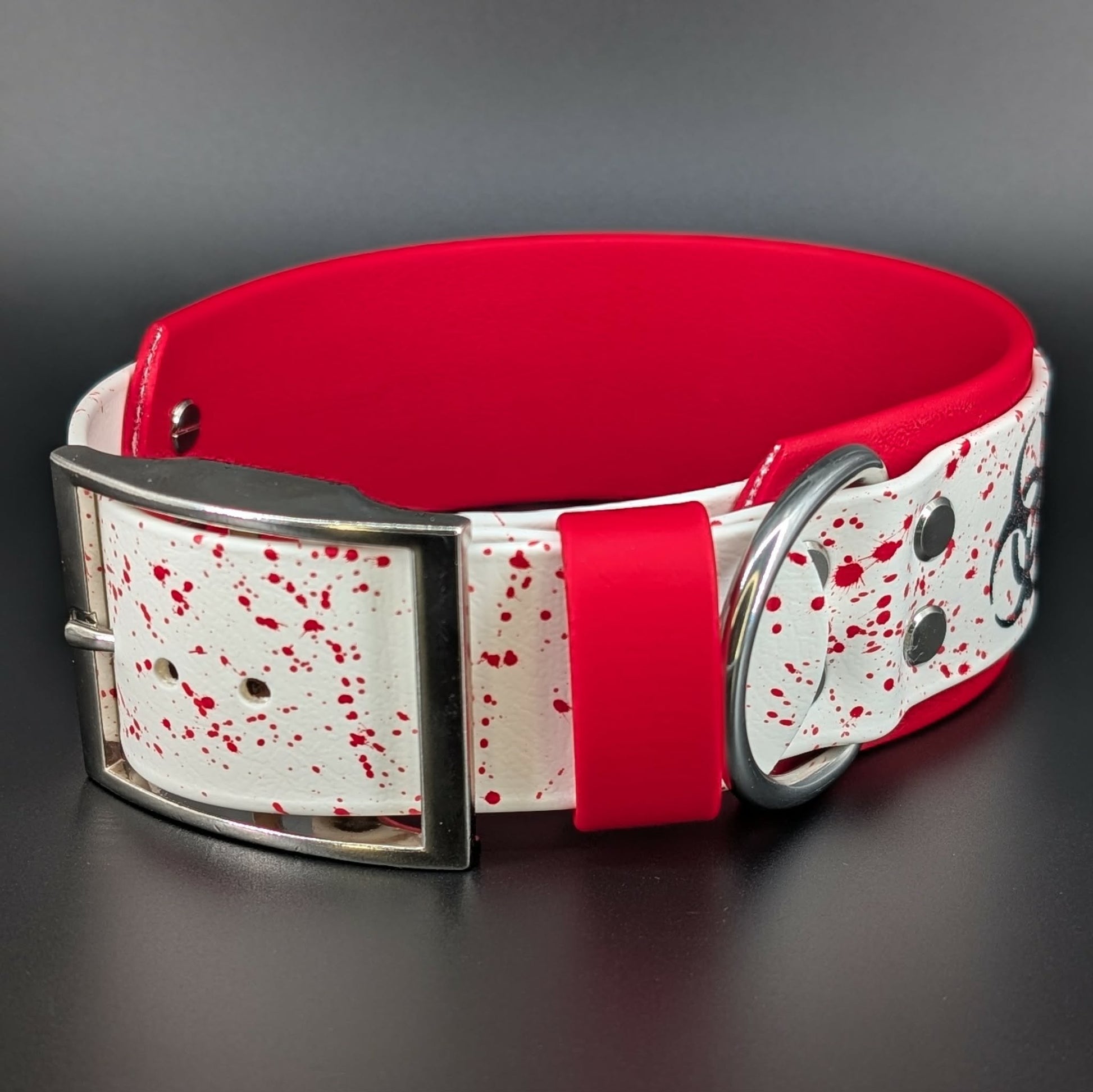 red splatter paint on red and white biothane biohazard collar