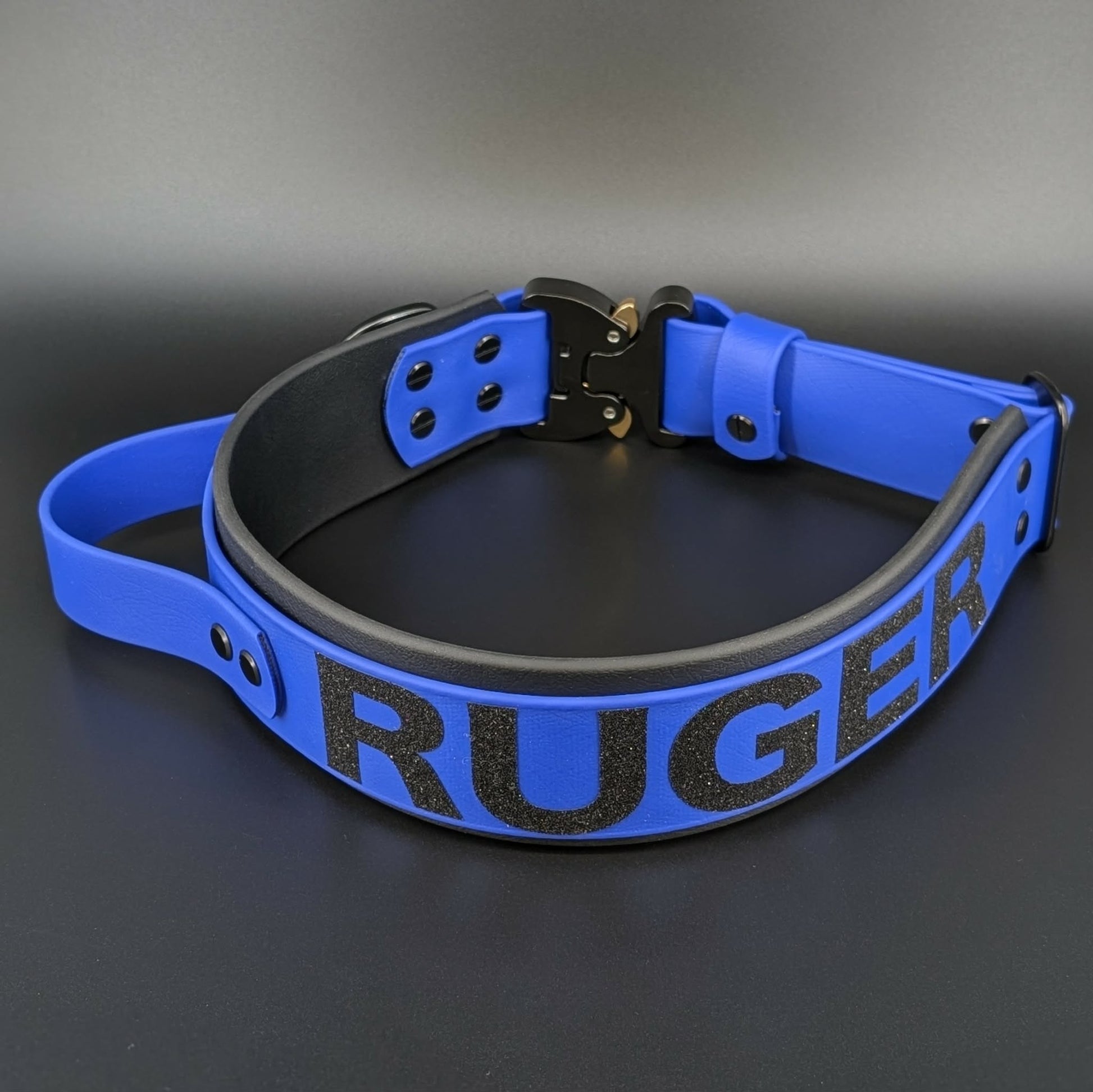 royal blue and black layered biothane dog collar with tactical handle and quick release cobra buckle and custom glitter text