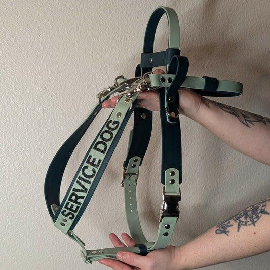 sage and dark green biothane service dog harness with counterbalance handle and pull strap for mobility assistance-dog
