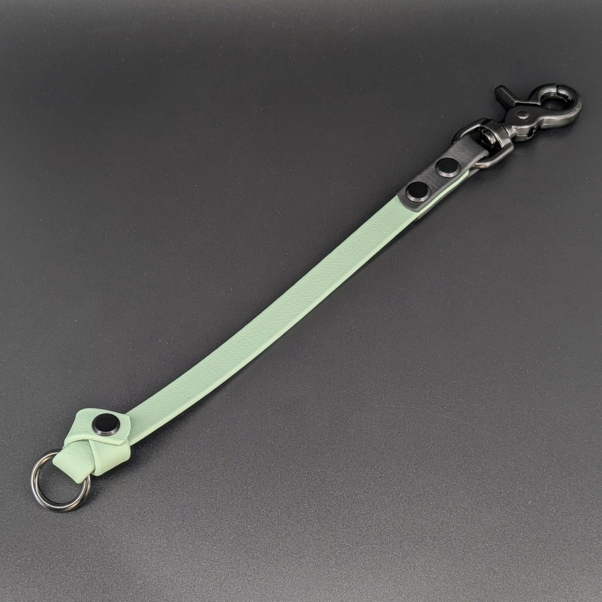 sage green and black biothane knotted traffic tab with o ring