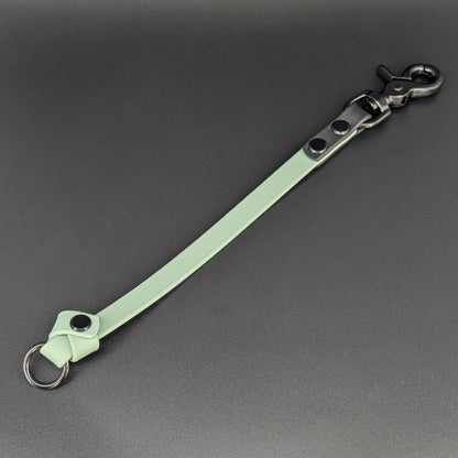 sage green and black biothane knotted traffic tab with o ring