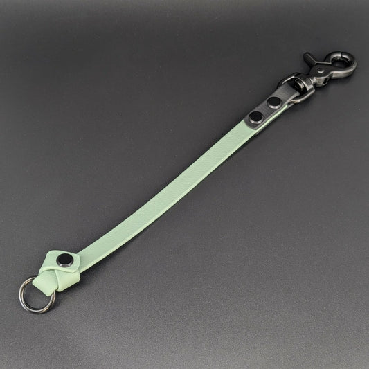 sage green and black biothane knotted traffic tab with o ring