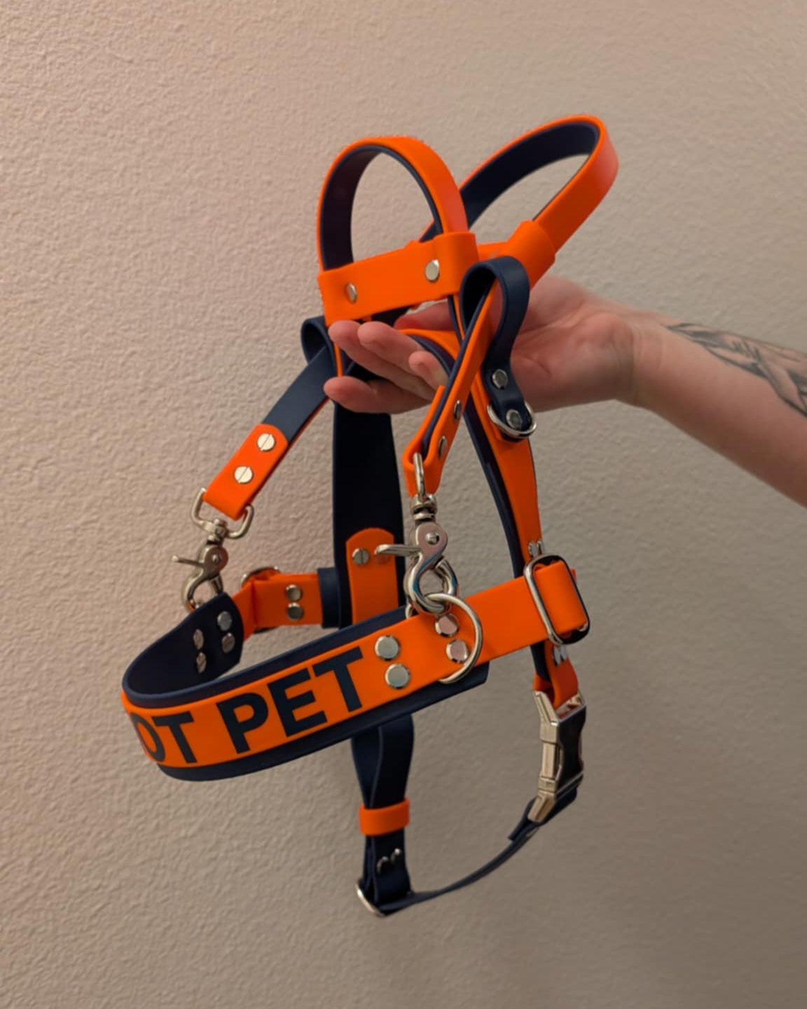dark blue and orange biothane straight front service dog harness with built-in counterbalance handle and detachable pull strap