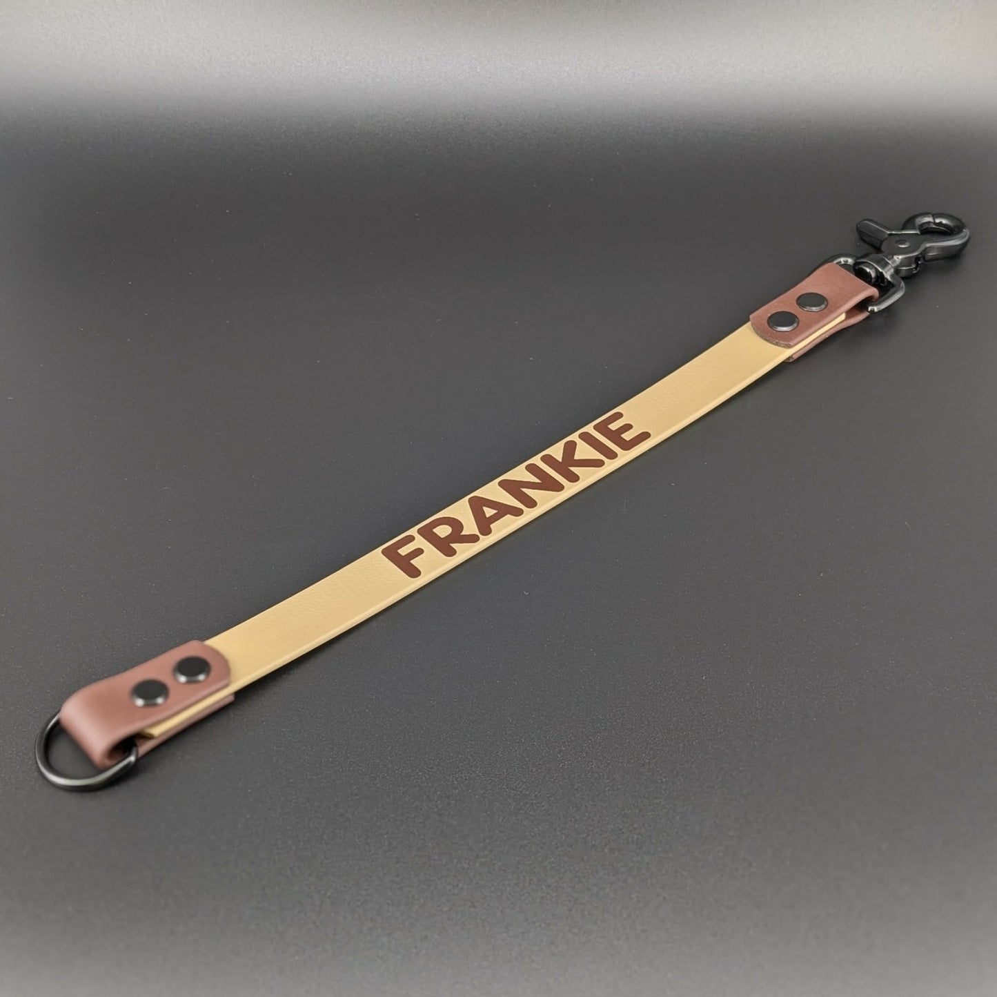 tan and dark brown biothane leash extender with custom text