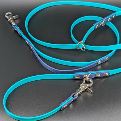 teal and navy blue biothane hands free leash with traffic handle and adjustable waist attachment point