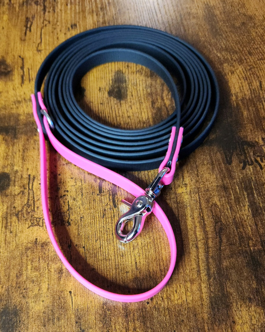 waterproof dog leash made out of pink and black biothane with silver hardware