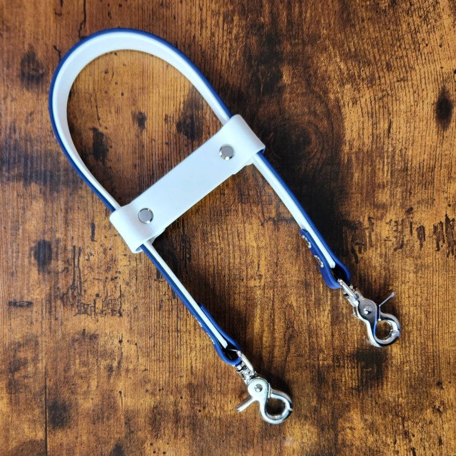 white and navy biothane pull strap