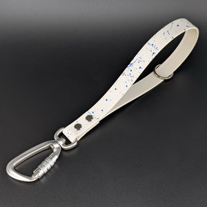 white biothane traffic handle with blue splatter paint and silver carabiner
