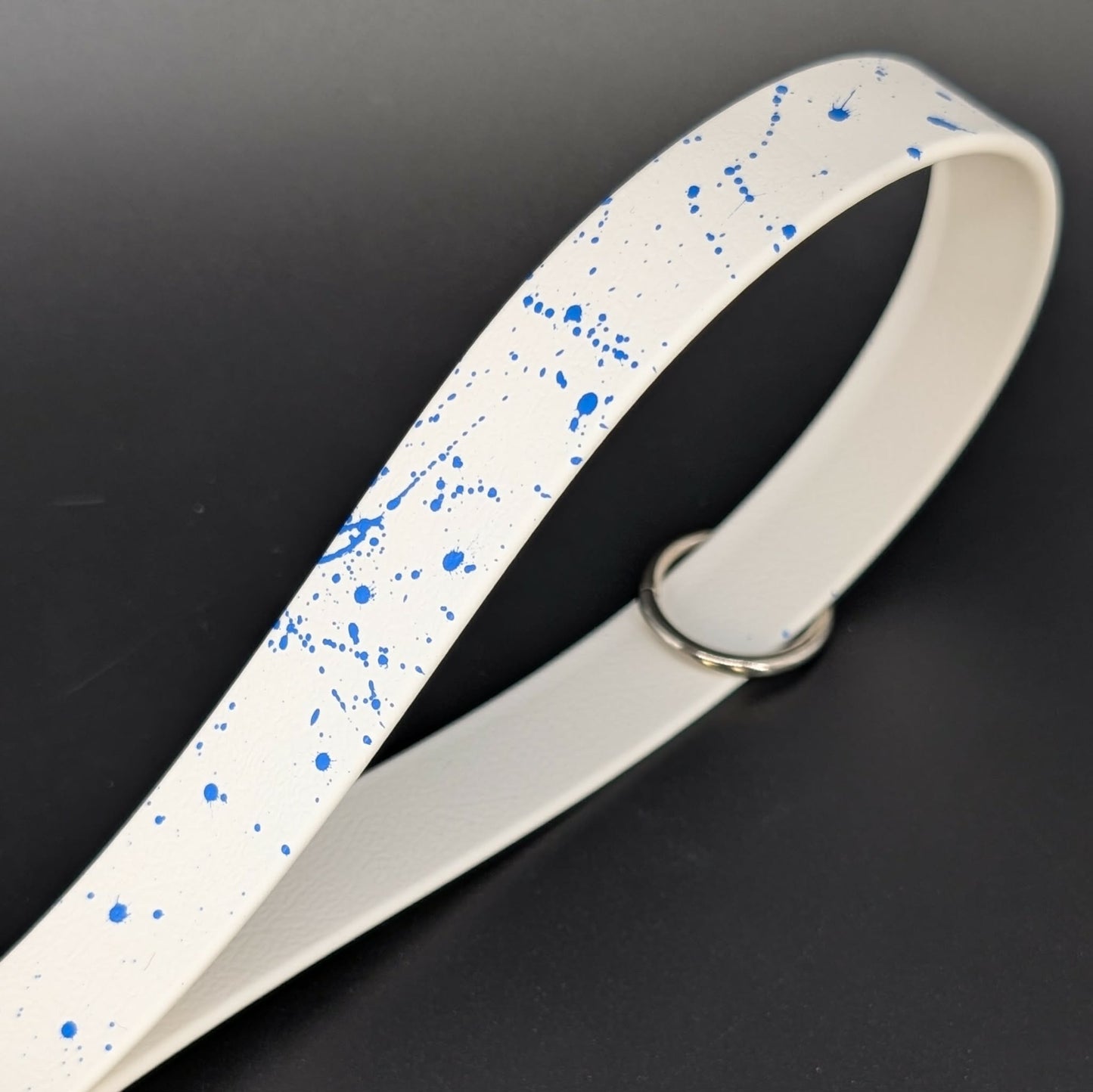 white biothane traffic handle with blue splatter paint