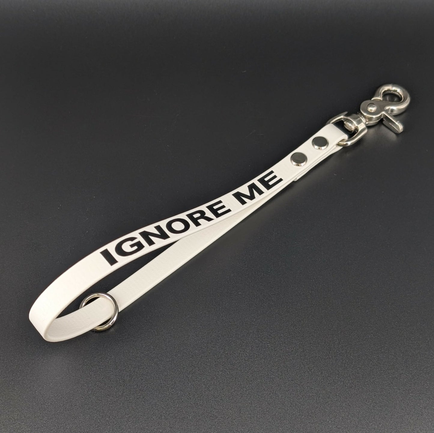 white biothane traffic handle with bold black IGNORE ME text