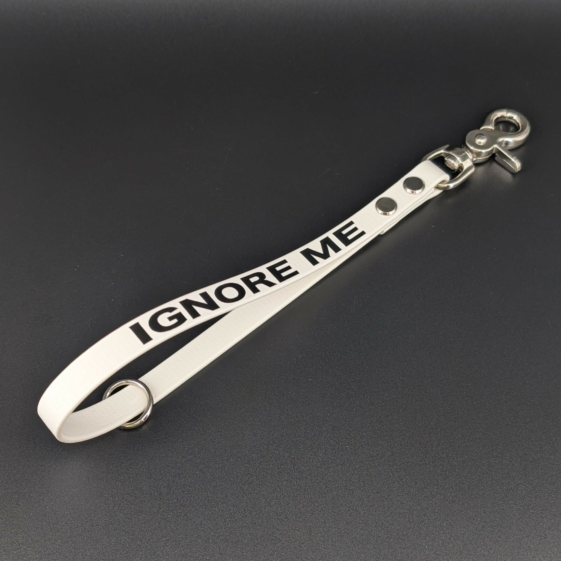 white biothane traffic handle with bold black IGNORE ME text
