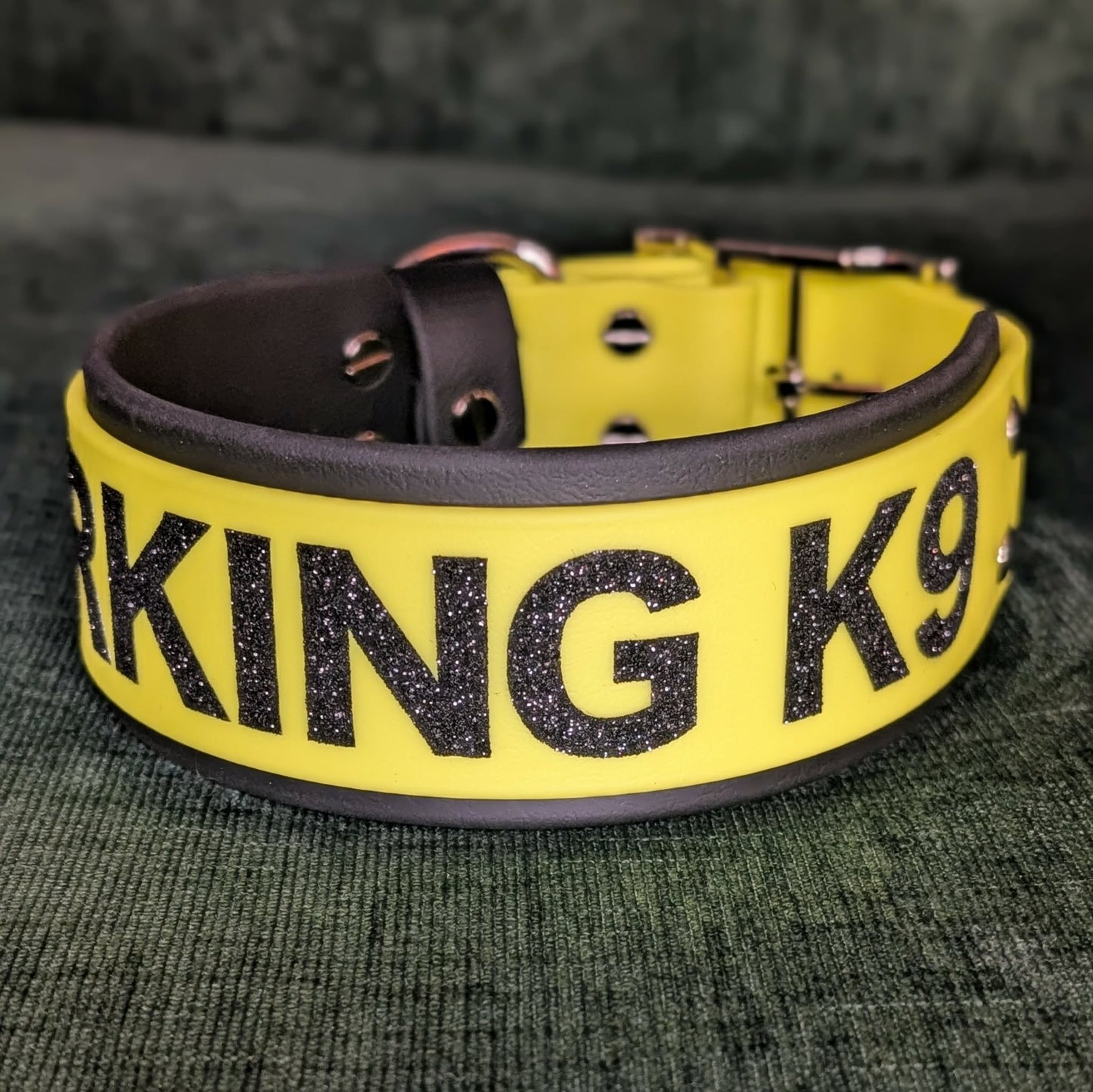 2 inch wide black and yellow layered biothane dog collar with black glitter text WORKING K9